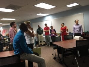 A group of people standing in a room.