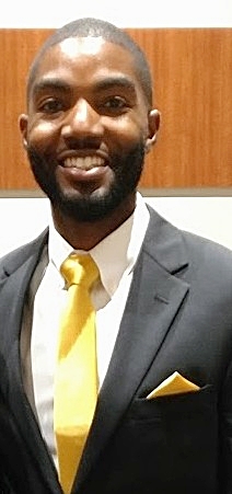 A man in a suit with a yellow tie offering one-on-one consultation based upon each individual customer’s specific requirements.