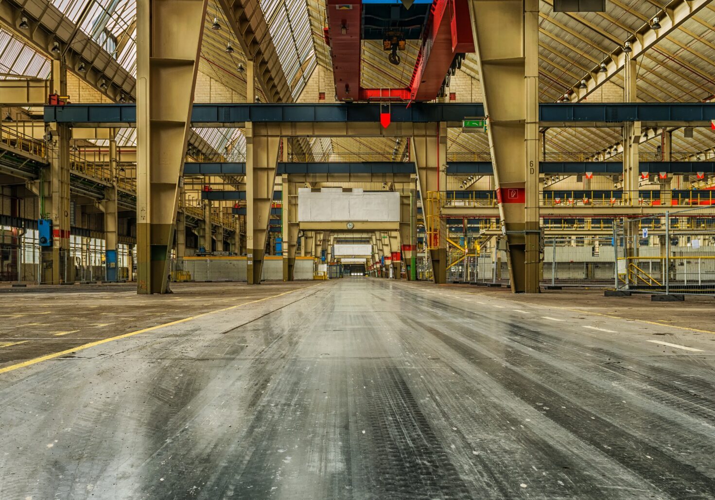 A long hallway in an empty industrial building demonstrates a commitment to continuous improvement.